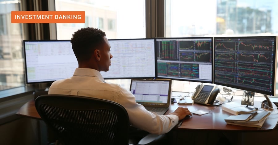 A professional analyst monitoring multiple screens of financial data and market charts, demonstrating how AI in investment banking unifies fragmented data to accelerate deal research and proposal generation.
