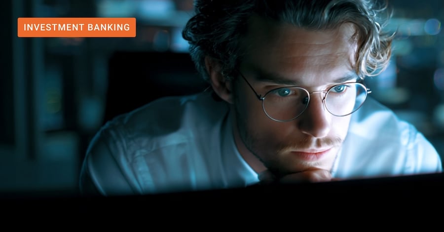 A focused financial professional analyzing intricate portfolio metrics on a glowing monitor at night, illustrating the use of AI in investment banking to drive operational alpha and contract compliance across portfolio companies.