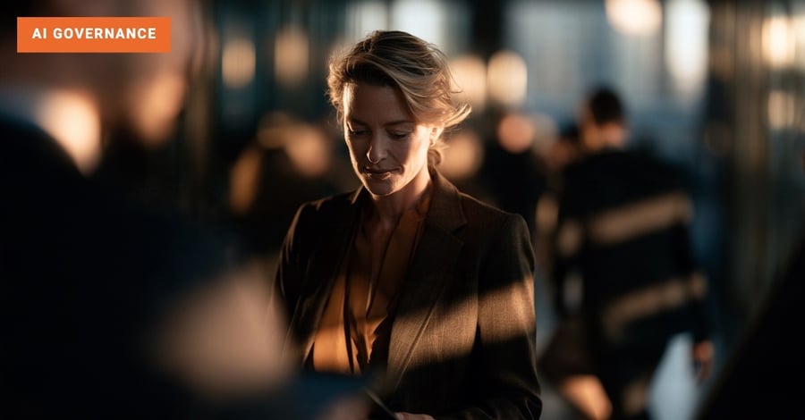 Businesswoman slowing mid-stride in a sunlit glass office corridor, glancing at a tablet as a colleague turns toward her