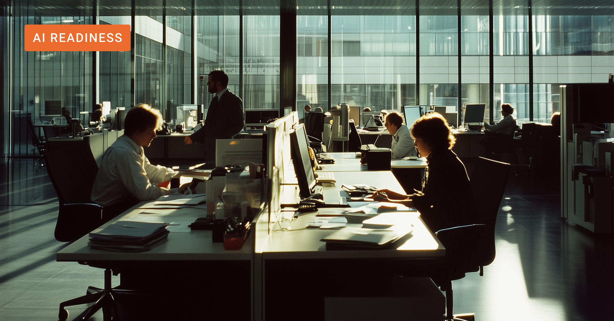 Office workers sitting at their desks. 